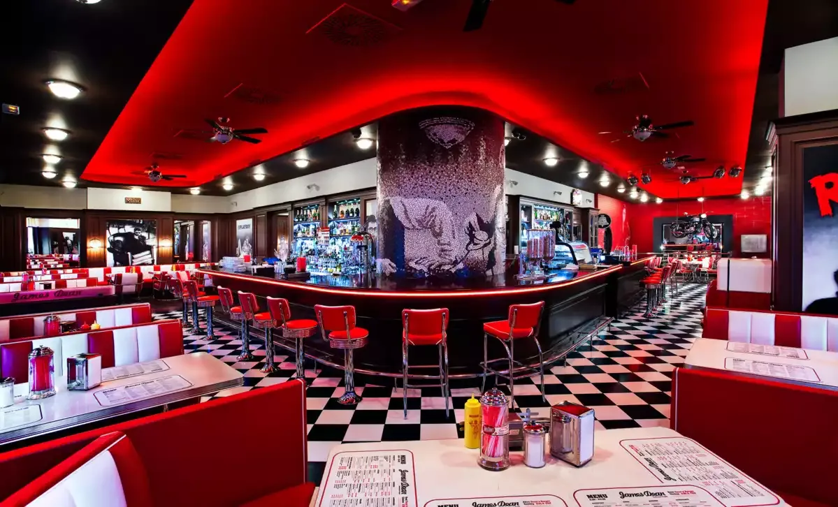The James Dean Prague diner with the mosaic pillar and the long bar